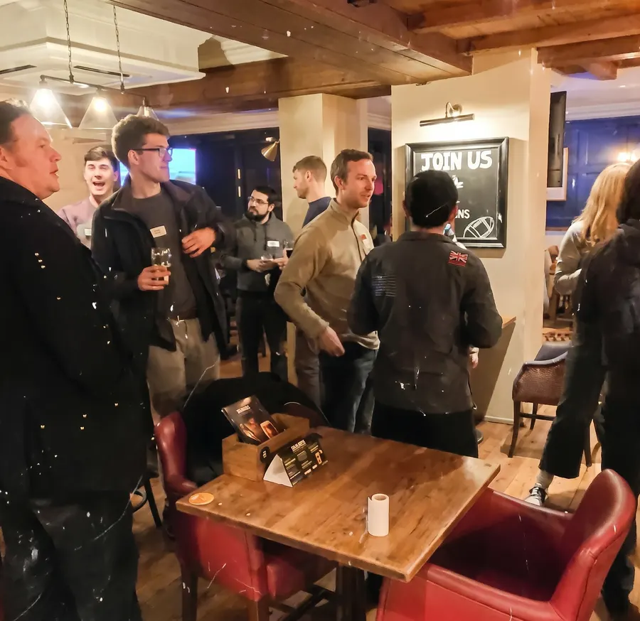 A busy pub room full of people at a Guildford Babel evening